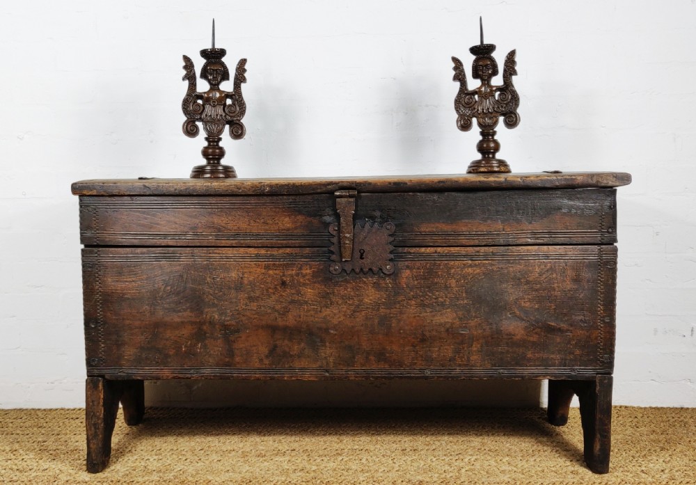 A 16th century English boarded oak coffer. 