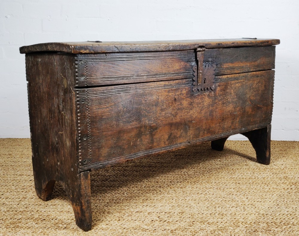 A 16th century English boarded oak coffer.  View III