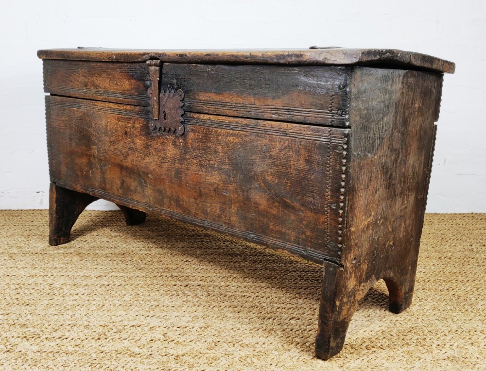 A 16th century English boarded oak coffer.  View IV
