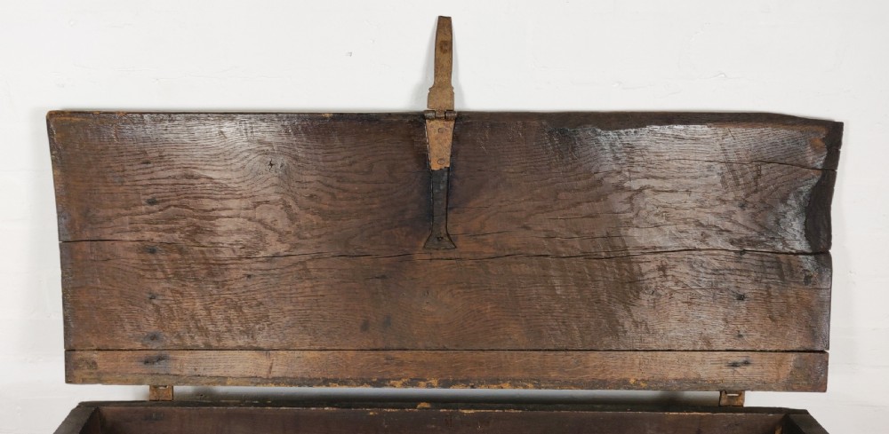 A 16th century English boarded oak coffer.  View IX