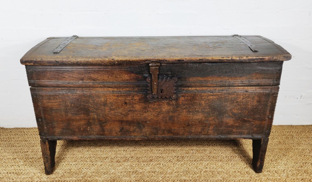 A 16th century English boarded oak coffer.  View XII
