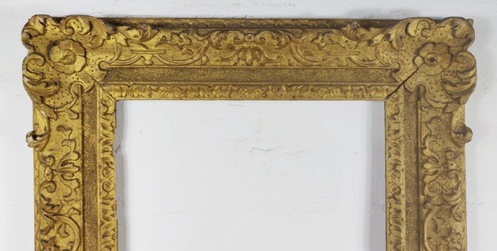 A decorative 18th century carved picture frame.  View III