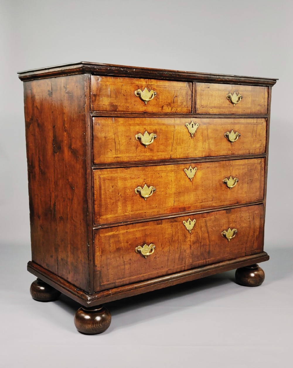 An early 18th century walnut chest of drawers. 