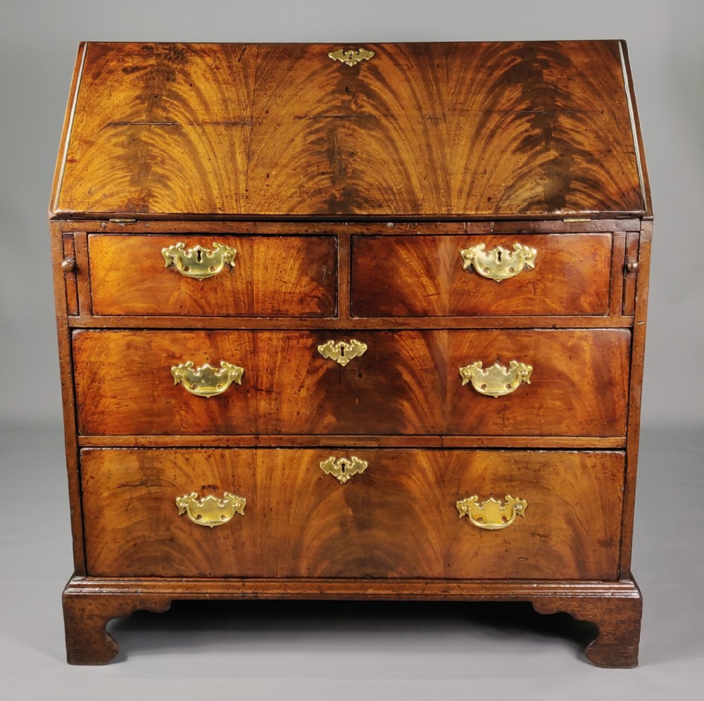A fine George III flame mahogany Bureau. 