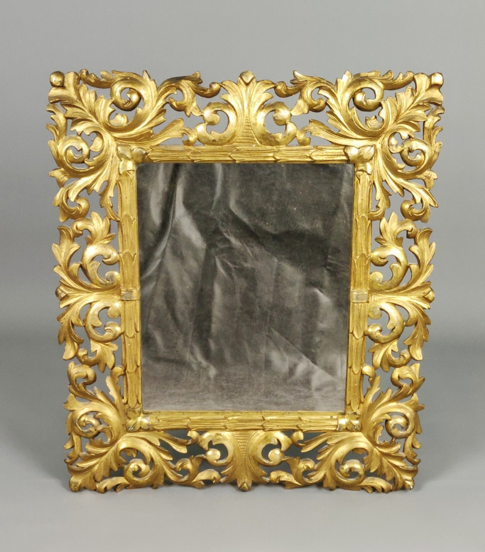 A decorative late 19th century Florentine mirror.