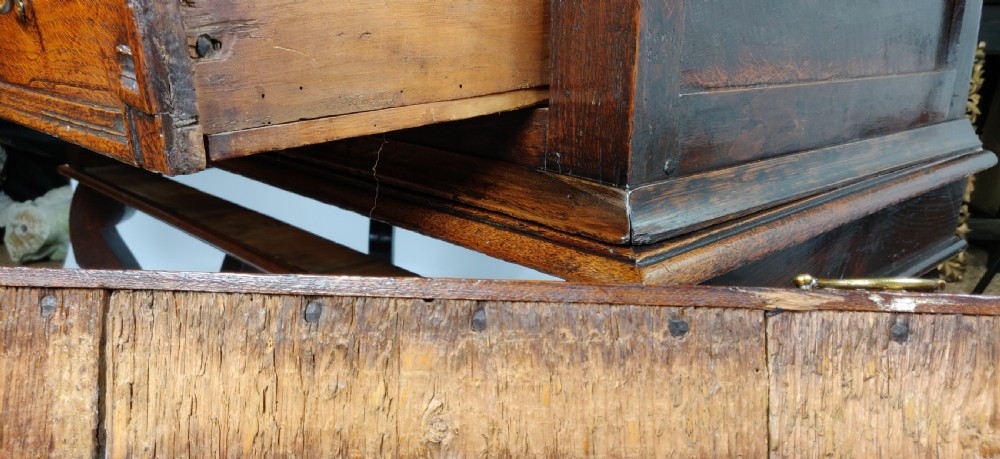 A late 17th century oak chest on stand. View XII