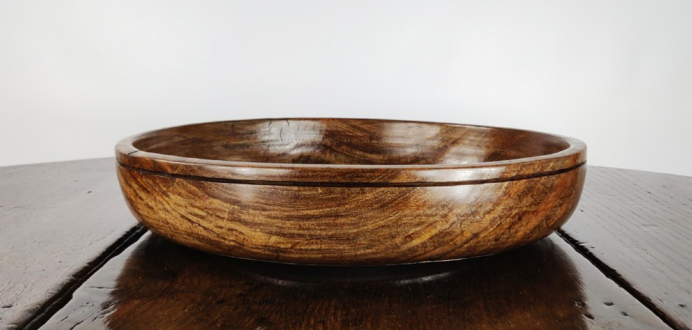 A large 19th century turned lignum vitae fruit bowl. View IV
