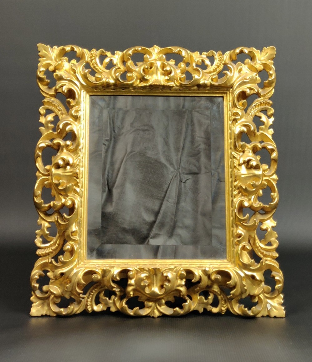 A small 19th century Florentine mirror. 