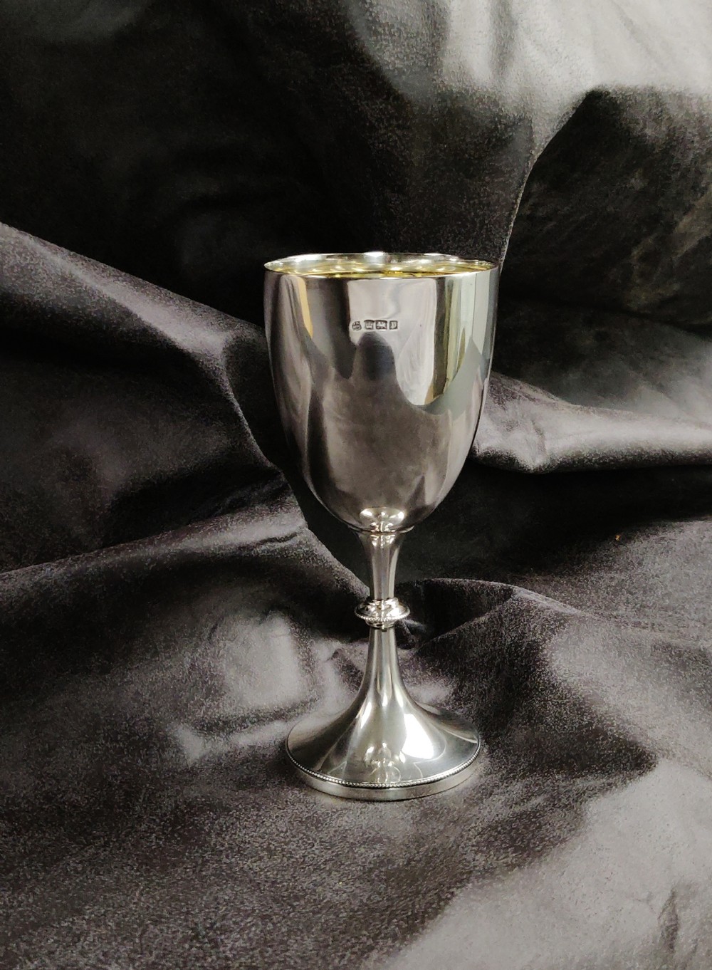 A small Edwardian silver goblet. 