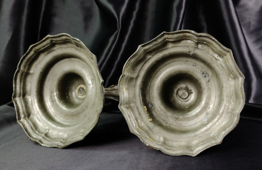 A pair of early 18th century pewter candlesticks.  View VII