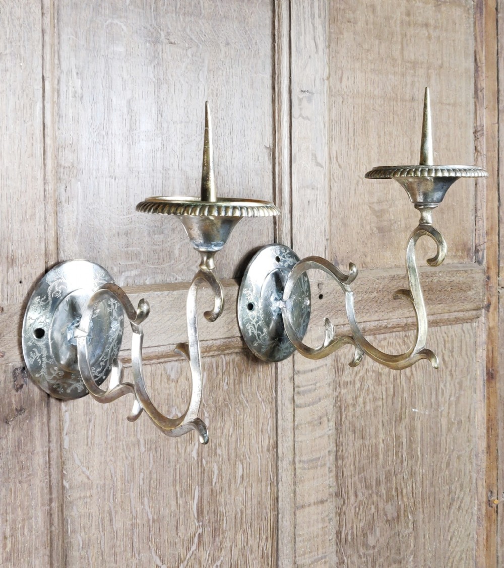 A pair of late 18thC gilt brass wall sconces.
