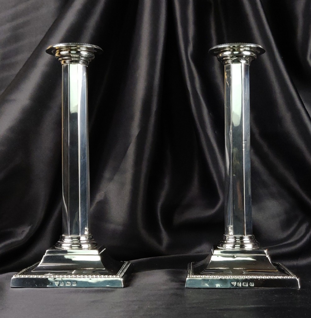A fine pair of silver candlesticks. 