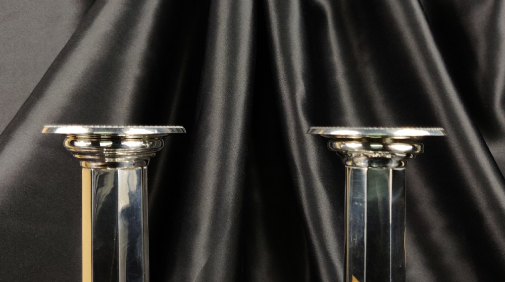 A fine pair of silver candlesticks.  View IX