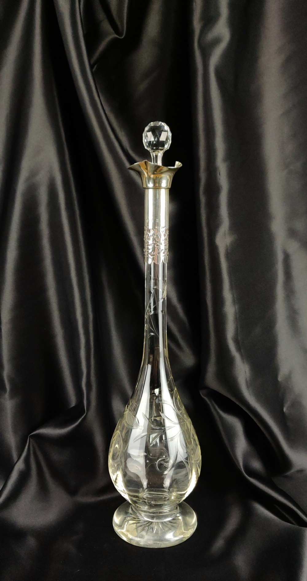A superb Edwardian long necked silver decanter. 