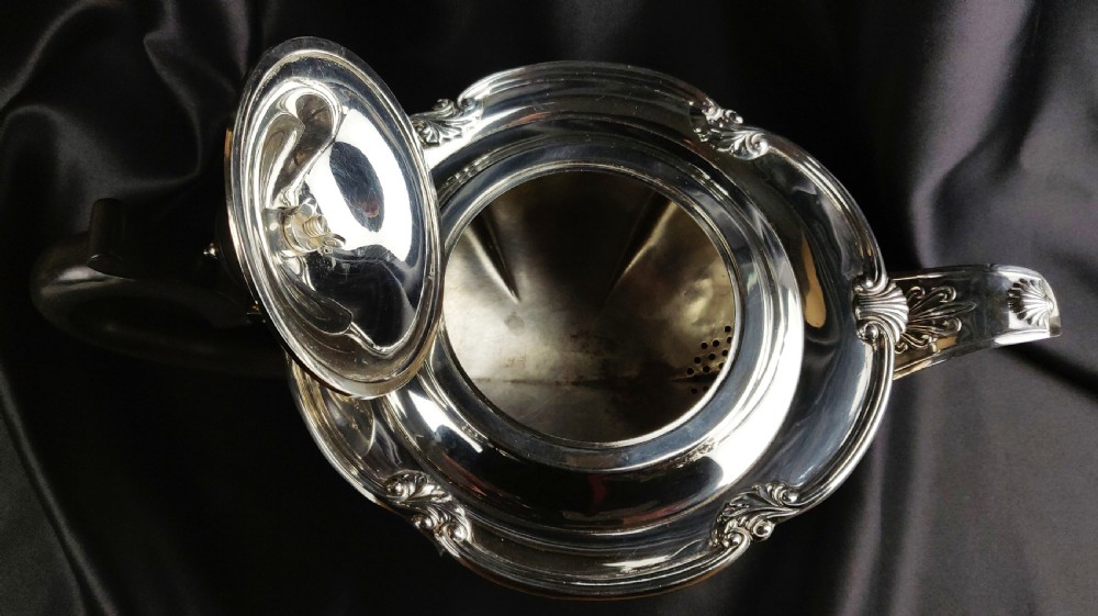 A 1930's three piece silver tea set by Walker & Hall.  View VII