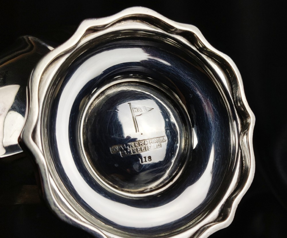 A 1930's three piece silver tea set by Walker & Hall.  View XIX
