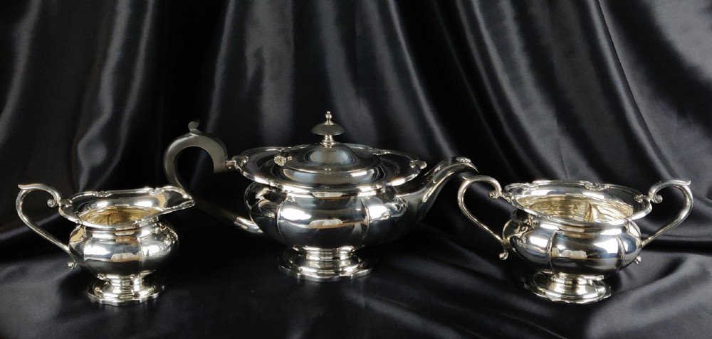 A 1930's three piece silver tea set by Walker & Hall.  View XXI