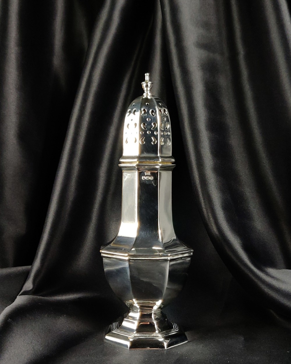 A 1930's silver sugar caster by Walker & Hall.
