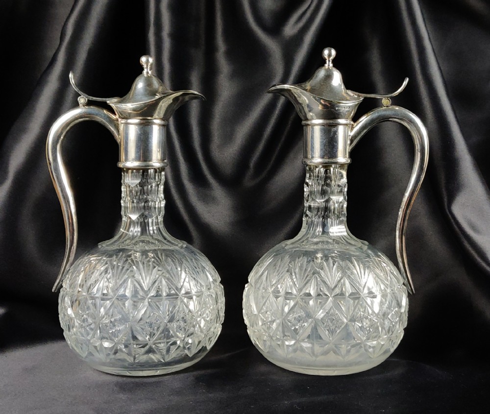 A pair of small Swedish silver claret jugs.