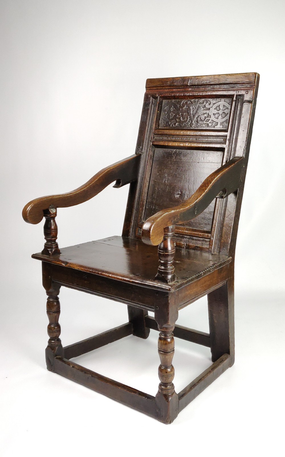 An early 17th century English wainscot chair. 
