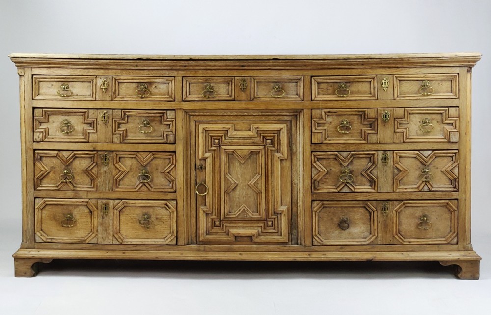 A geometric oak dresser base. 
