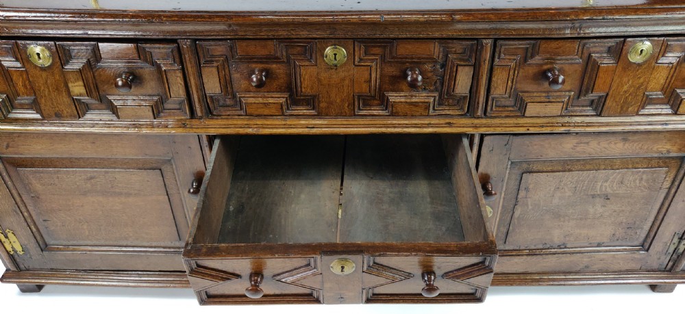 A fabulous late 17th century enclosed dresser base.  View XIII