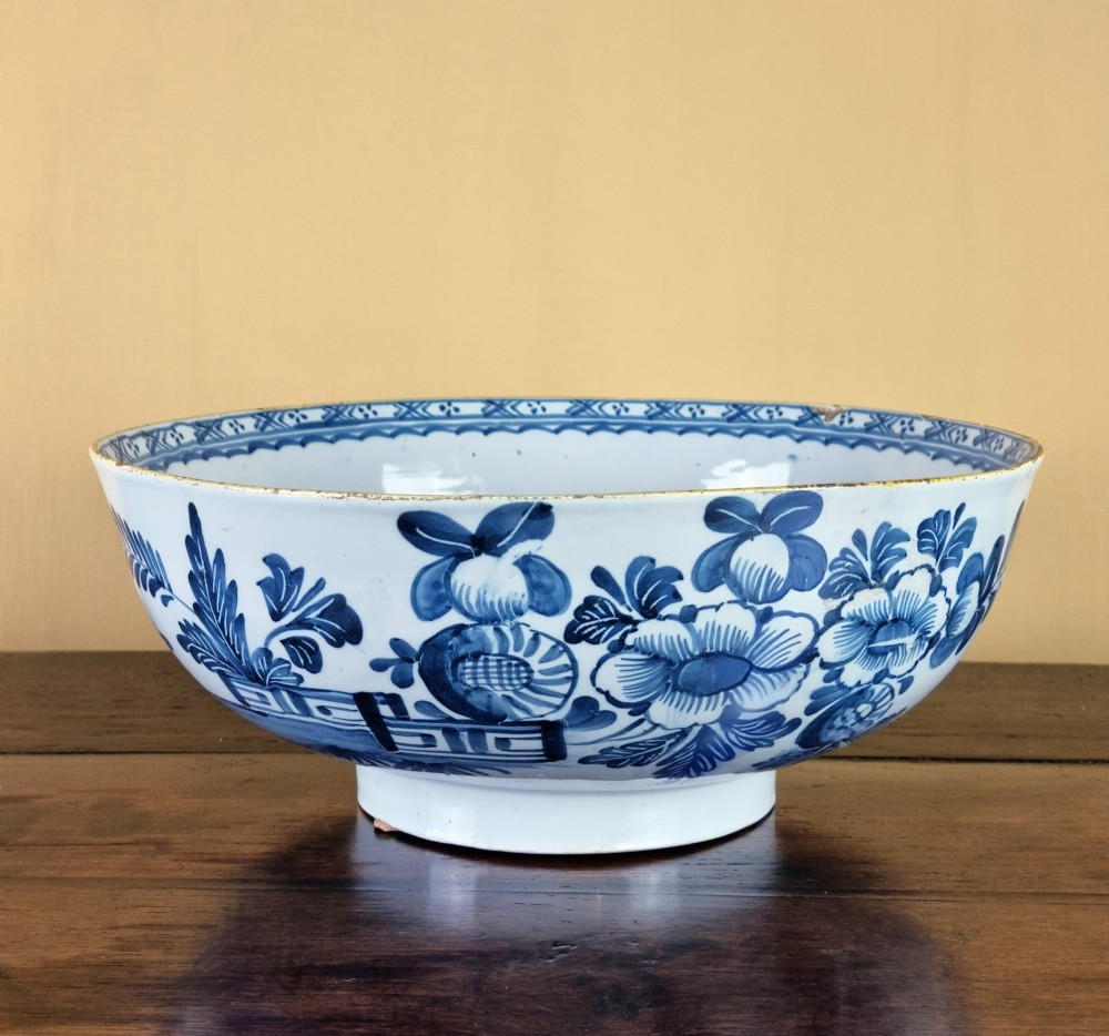A large 18th century English delft punch bowl. 