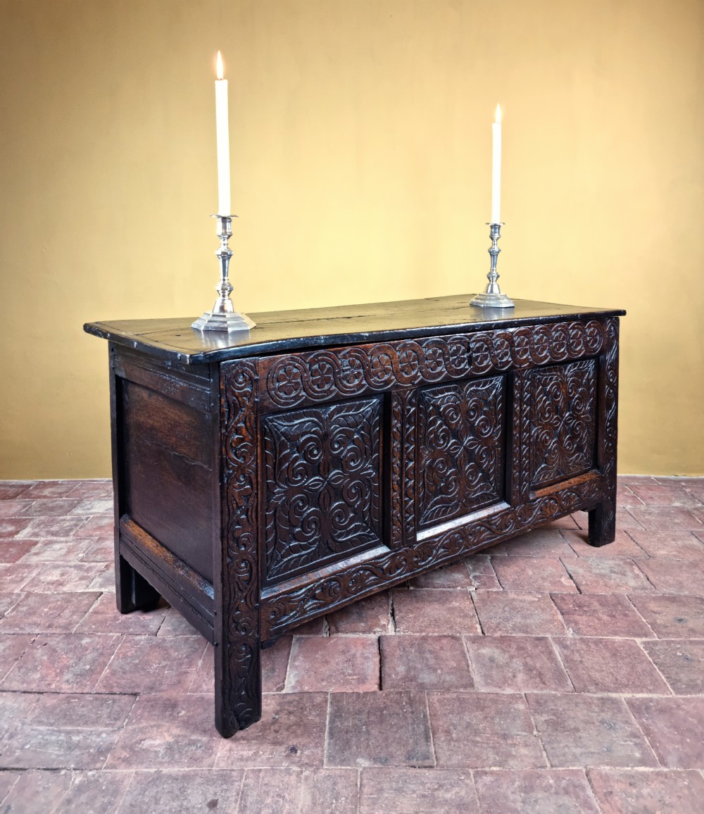 A 17th century carved oak coffer.  View II