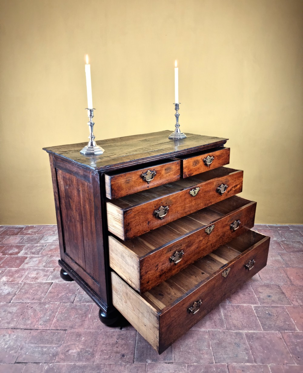 An 18th century walnut chest of drawers.  View III