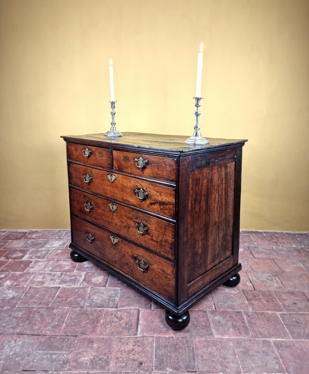 An 18th century walnut chest of drawers.  View IV