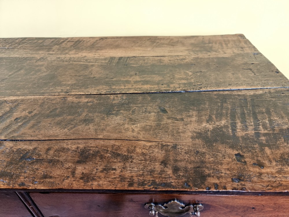 An 18th century walnut chest of drawers.  View IX