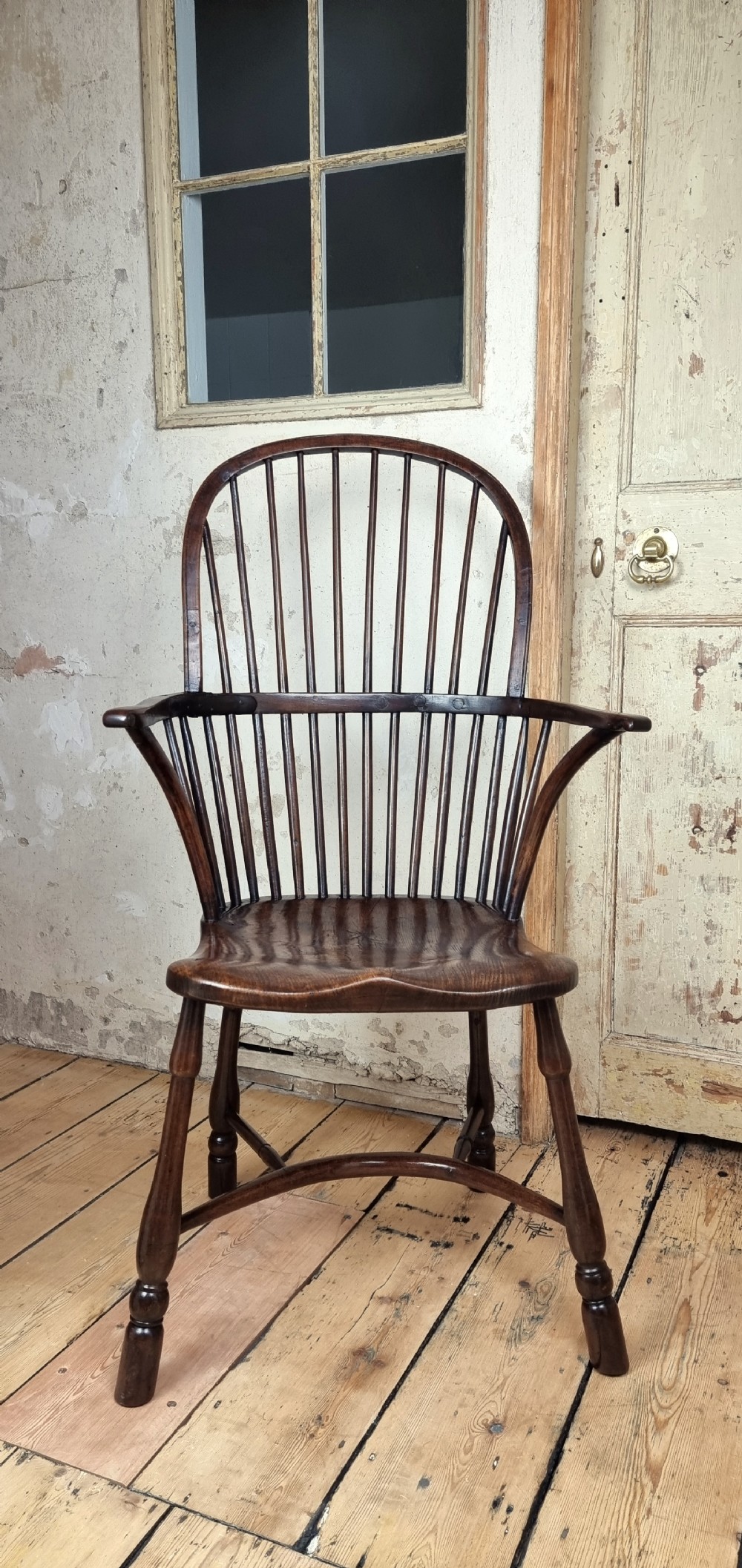 A late 18th century walnut windsor chair. 