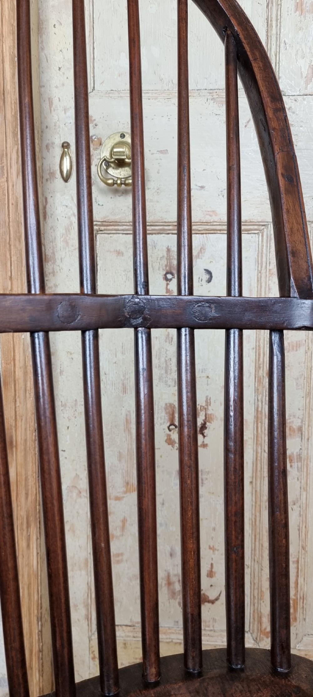 A late 18th century walnut windsor chair.  View VI