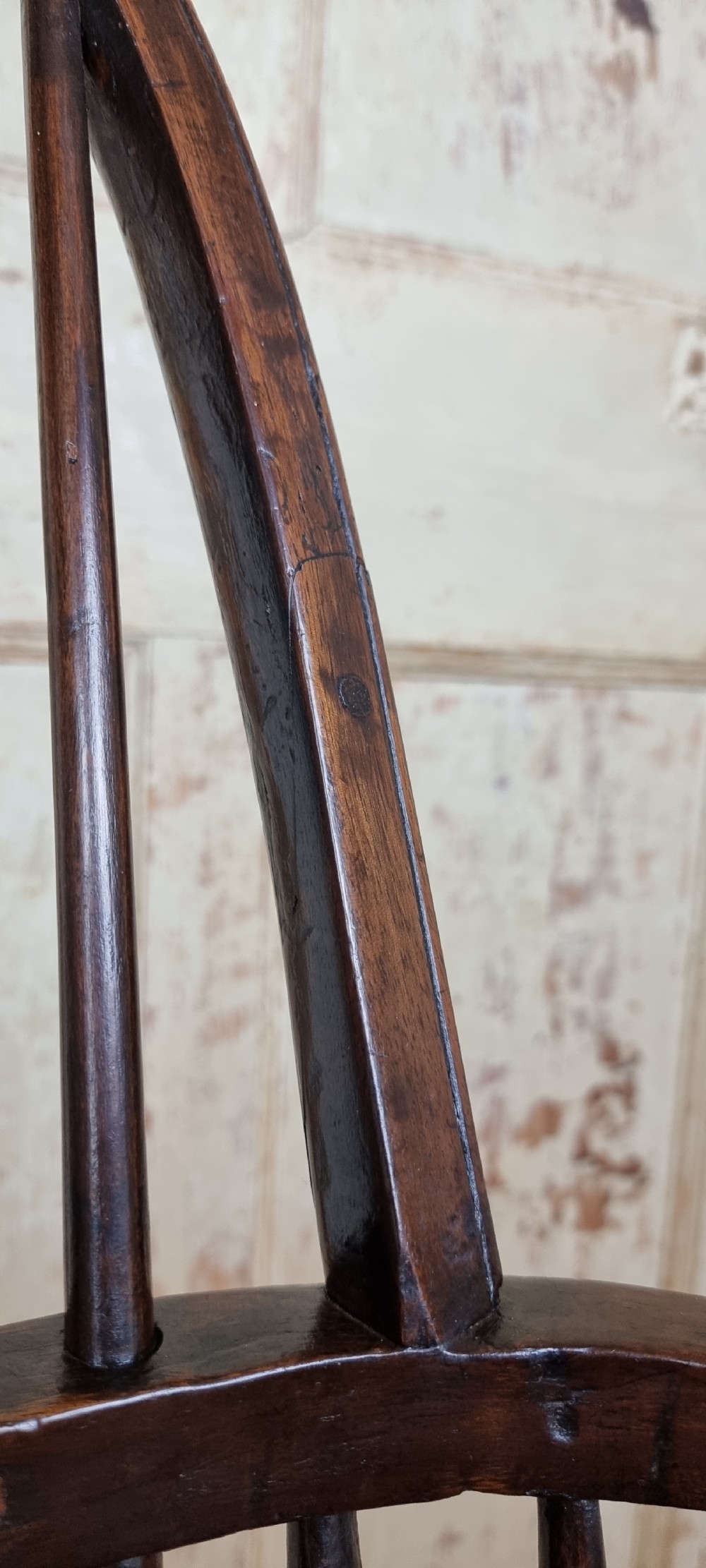 A late 18th century walnut windsor chair.  View VII