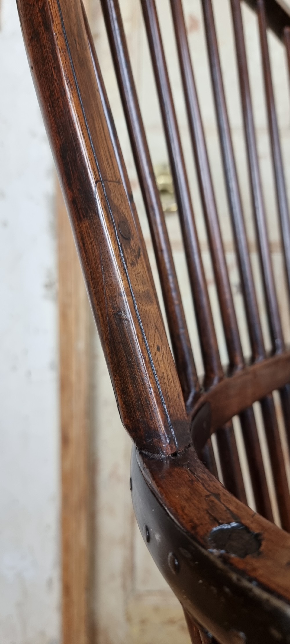 A late 18th century walnut windsor chair.  View VIII