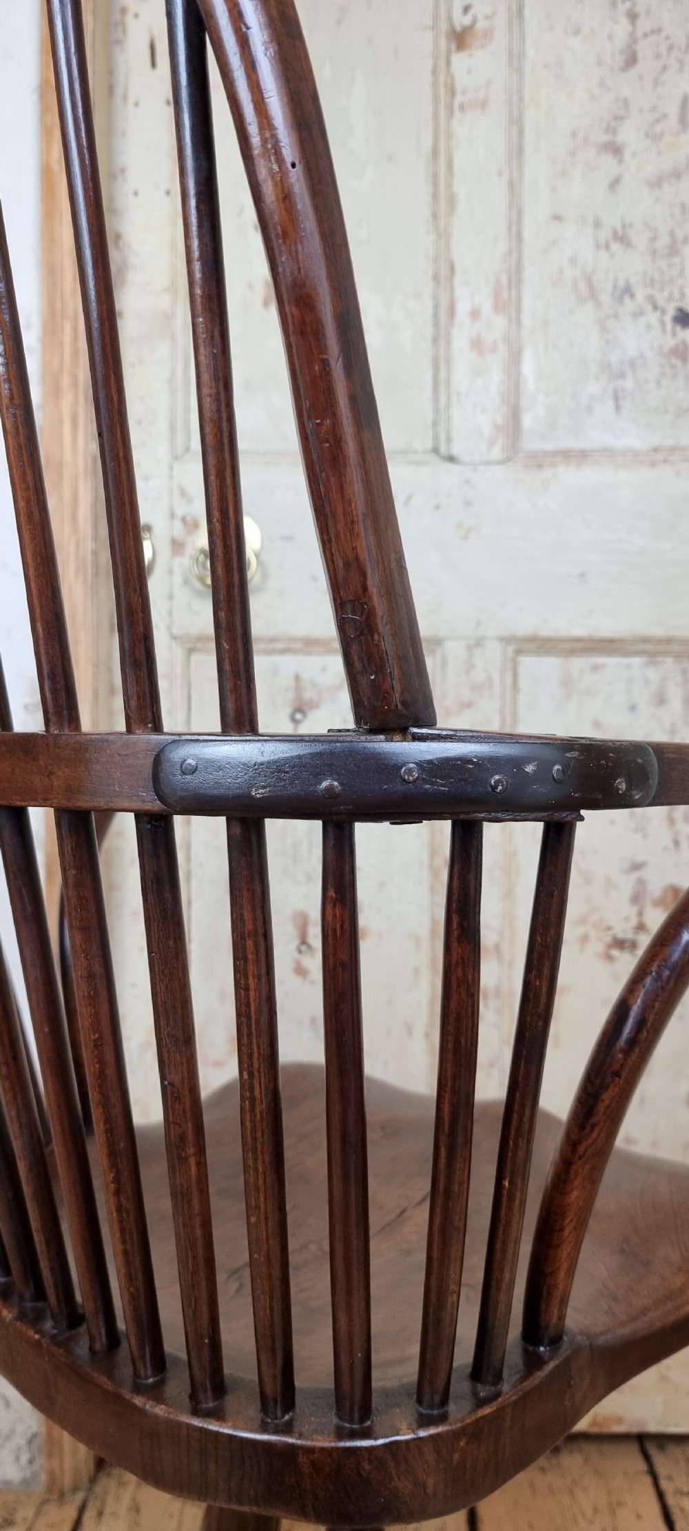 A late 18th century walnut windsor chair.  View IX
