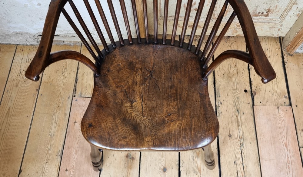 A late 18th century walnut windsor chair.  View XIII