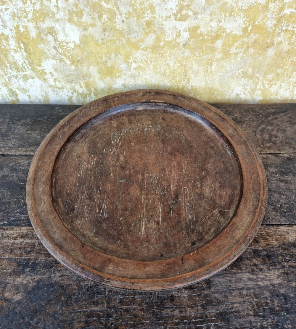 A large 19th century treen platter.  View III