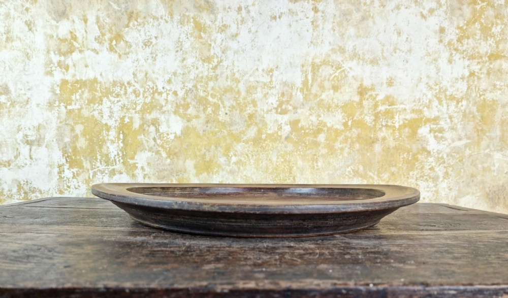 A large 19th century treen platter.  View IV