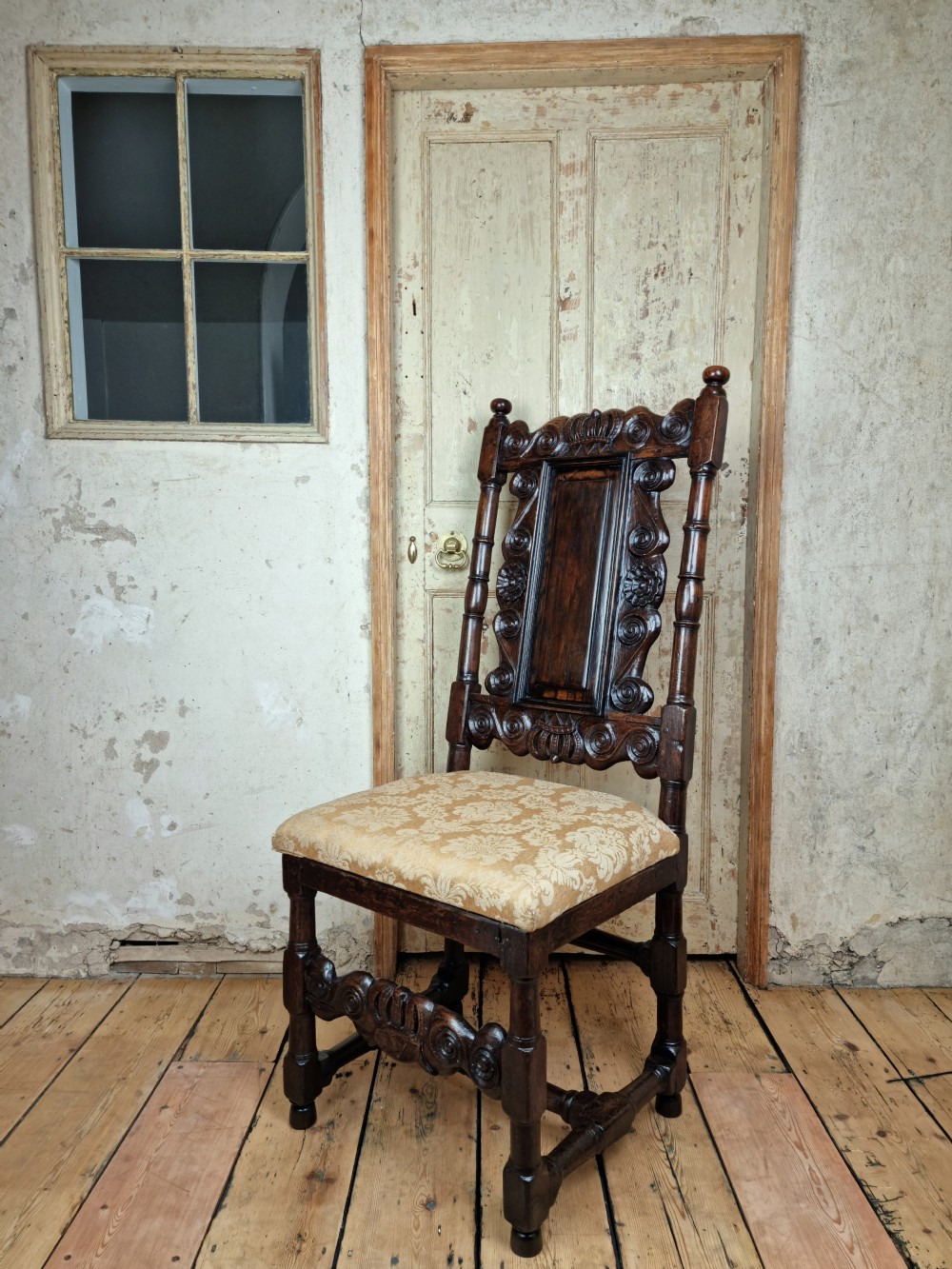 A late 17th century hall chair.  View II