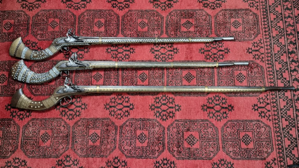 Three north western frontier flintlock muskets.  View IV