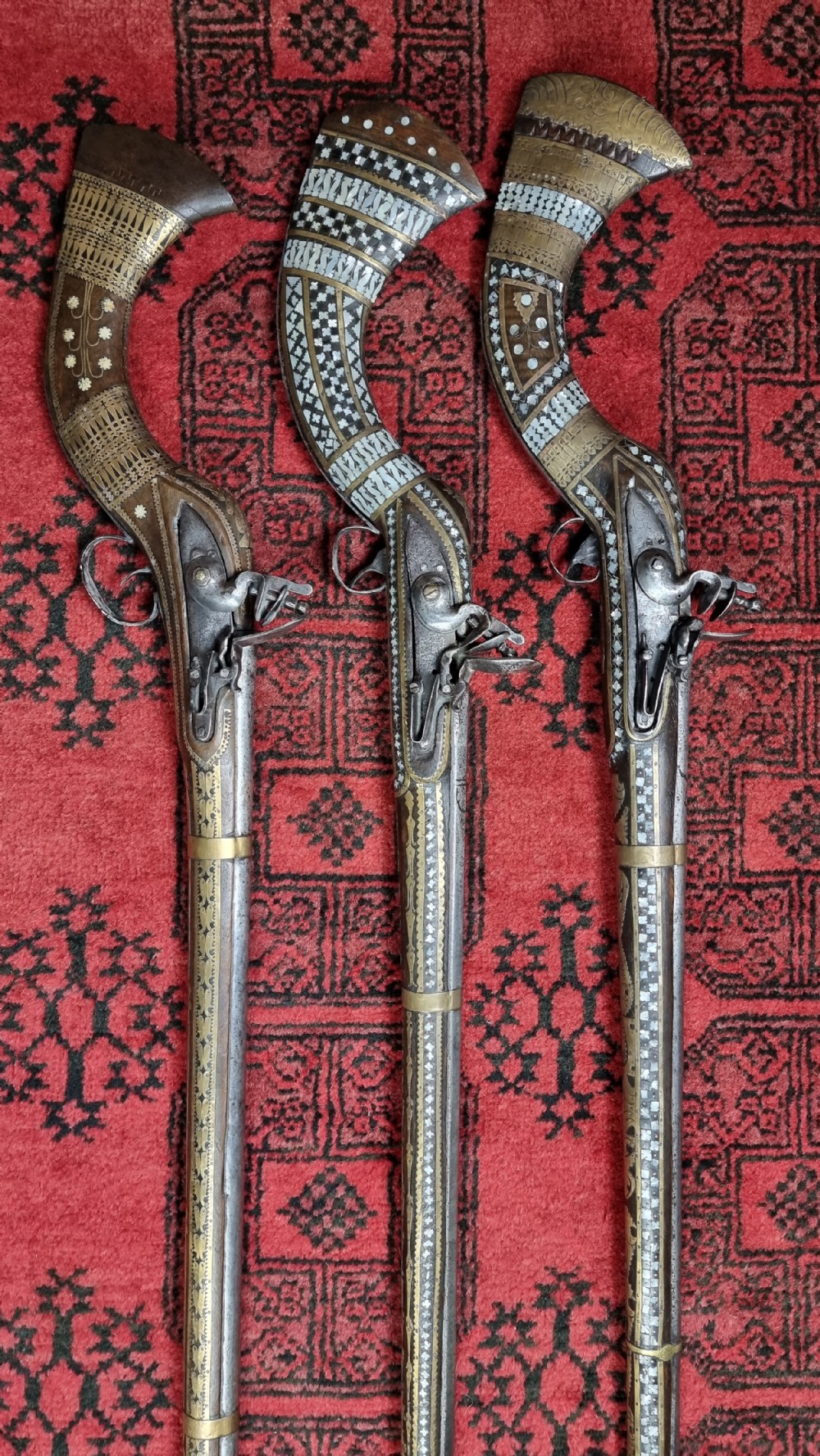 Three north western frontier flintlock muskets.  View V