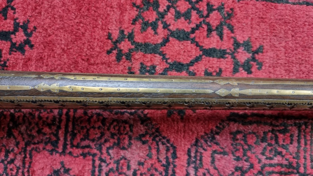 Three north western frontier flintlock muskets.  View XII