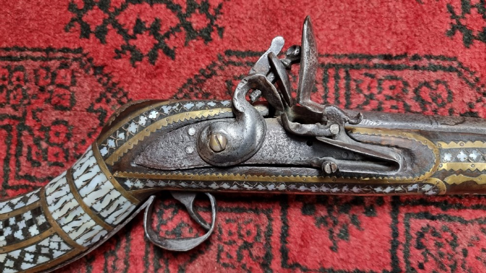 Three north western frontier flintlock muskets.  View XVII