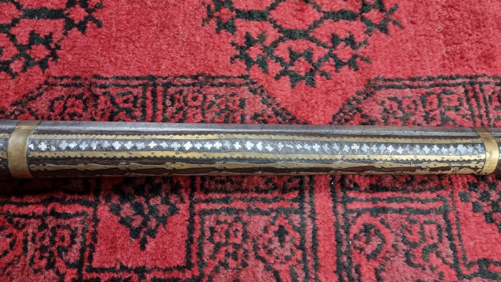 Three north western frontier flintlock muskets.  View XVIII