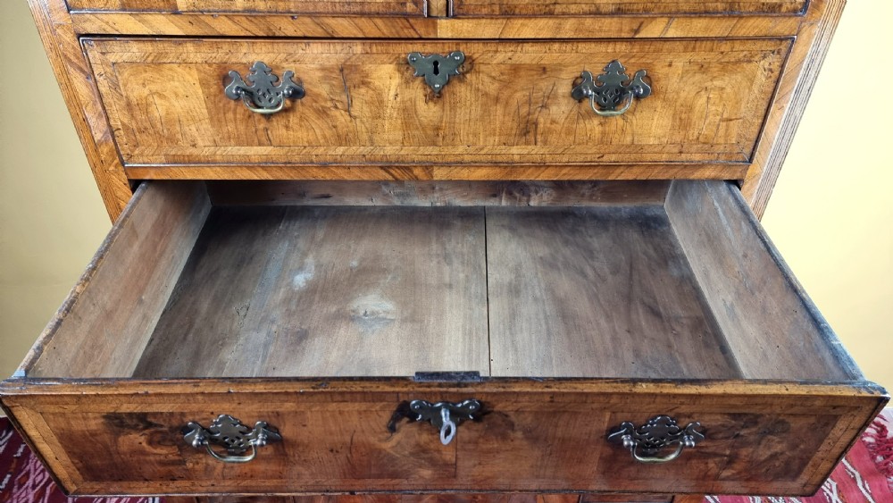 An early 18th century walnut chest on stand. View IX