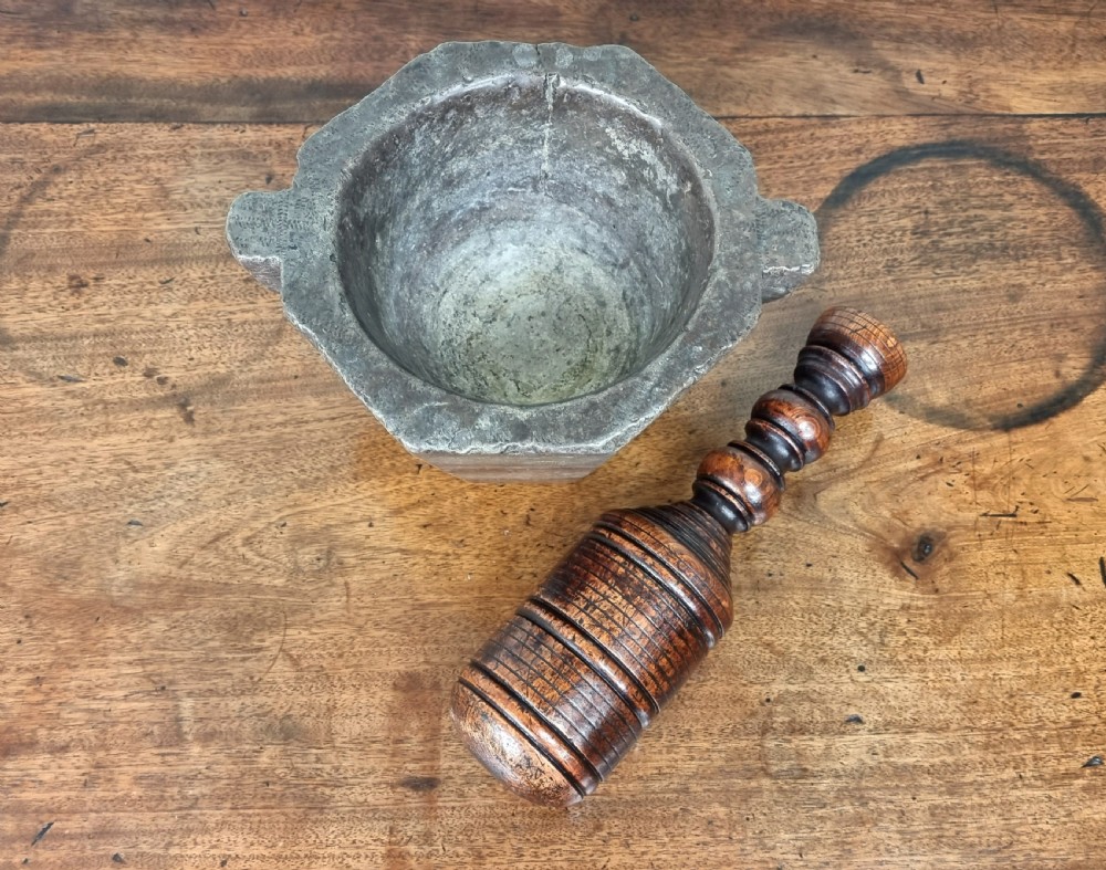 A 17th century marble mortar and pestle. View VI