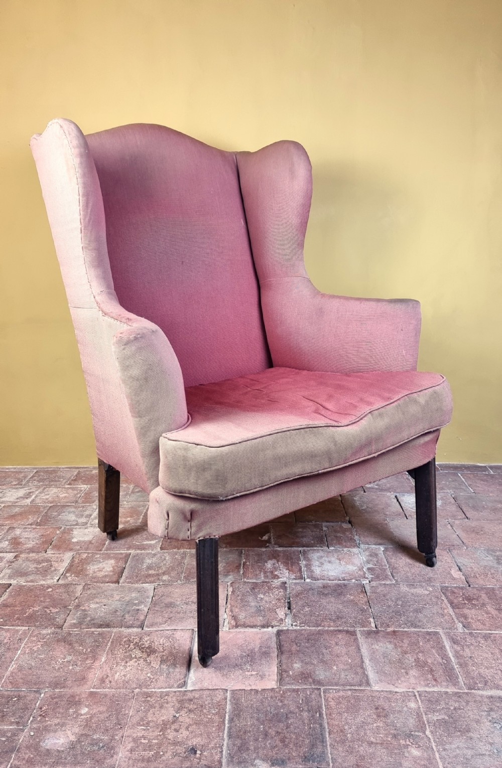 A large George III wing chair.